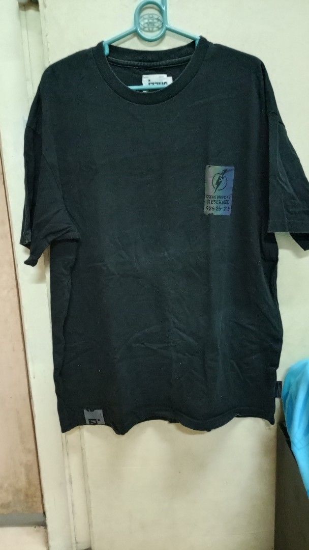 Izzue Black T-Shirt Size M (Category: Tshirts & Polo Shirts ) located in Manila. Submitted by rizu09 (Listing ID 1470039896, Image 1). Description: - Brand: Izzue - Color: Black - Size: Medium - Design: Iridescent graphic print with lightning bolt on chest; large numbers and lettering on the back - Fit: Short sleeves, crew neck, straight hem - Condition: Excellent / Great for .