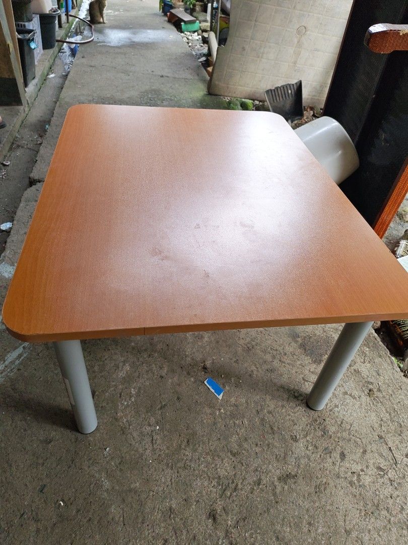 Japan surplus Low table (Category: Tables & Sets) located in Manila. Submitted by aks_japansurplus30 (Listing ID 1469986991, Image 3). Description: - Versatile compact table for study, work, or dining - Smooth wooden top with a stylish woodgrain finish and safe rounded corners - Four sturdy silver-grey cylindrical metal legs with secure screw plate attachment - Solid build that remains stable on flat surfaces - Space-saving design, perfect for co