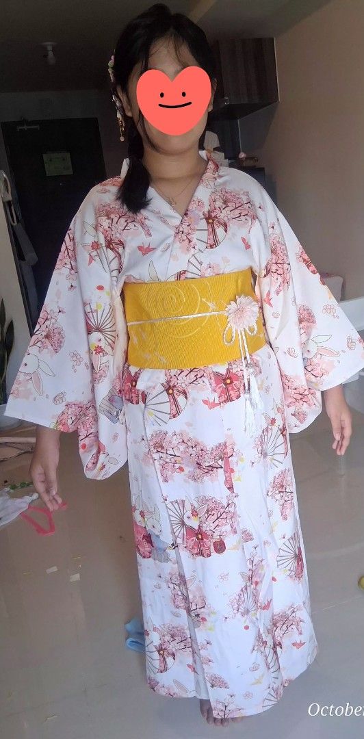 Japanese Kimono for rent only (Category: Traditional & Ethnic wear) located in Quezon City. Submitted by zaraaaaaahhhhhh (Listing ID 1469967106, Image 2). Description: - Japanese kimono in soft pink - Features a charming cherry blossom and white bunny print - Includes a vibrant yellow textured obi belt with decorative ornament and tassel - Brand new white split-toe tabi socks (size 23.5 cm) - Worn once include hair accessories - Condition: Like n