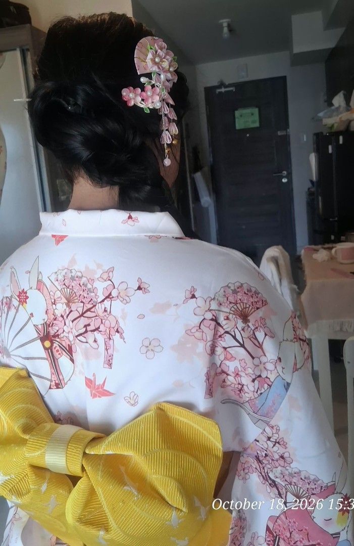 Japanese Kimono for rent only (Category: Traditional & Ethnic wear) located in Quezon City. Submitted by zaraaaaaahhhhhh (Listing ID 1469967106, Image 1). Description: - Japanese kimono in soft pink - Features a charming cherry blossom and white bunny print - Includes a vibrant yellow textured obi belt with decorative ornament and tassel - Brand new white split-toe tabi socks (size 23.5 cm) - Worn once include hair accessories - Condition: Like n