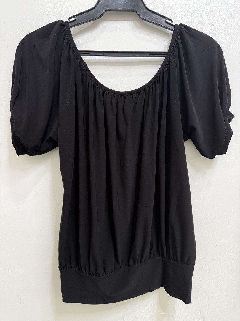 Jason Maxwell Black Puff Sleeve Blouse (Category: Blouses) located in Quezon City. Submitted by reivia.vend (Listing ID 1469998123, Image 3). Description: - Brand: Jason Maxwell - Color: Classic Black - Neckline: Scoop neck with stylish front gathered detailing - Sleeves: Short puff sleeves with cuffs - Fit: Fitted look with a wide banded hem at the bottom - Material: Stretchy, comfortable fabric - Versatile: Easy to pair with jeans or skirts for