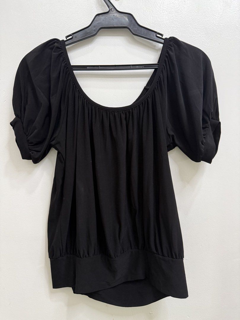 Jason Maxwell Black Puff Sleeve Blouse (Category: Blouses) located in Quezon City. Submitted by reivia.vend (Listing ID 1469998123, Image 1). Description: - Brand: Jason Maxwell - Color: Classic Black - Neckline: Scoop neck with stylish front gathered detailing - Sleeves: Short puff sleeves with cuffs - Fit: Fitted look with a wide banded hem at the bottom - Material: Stretchy, comfortable fabric - Versatile: Easy to pair with jeans or skirts for