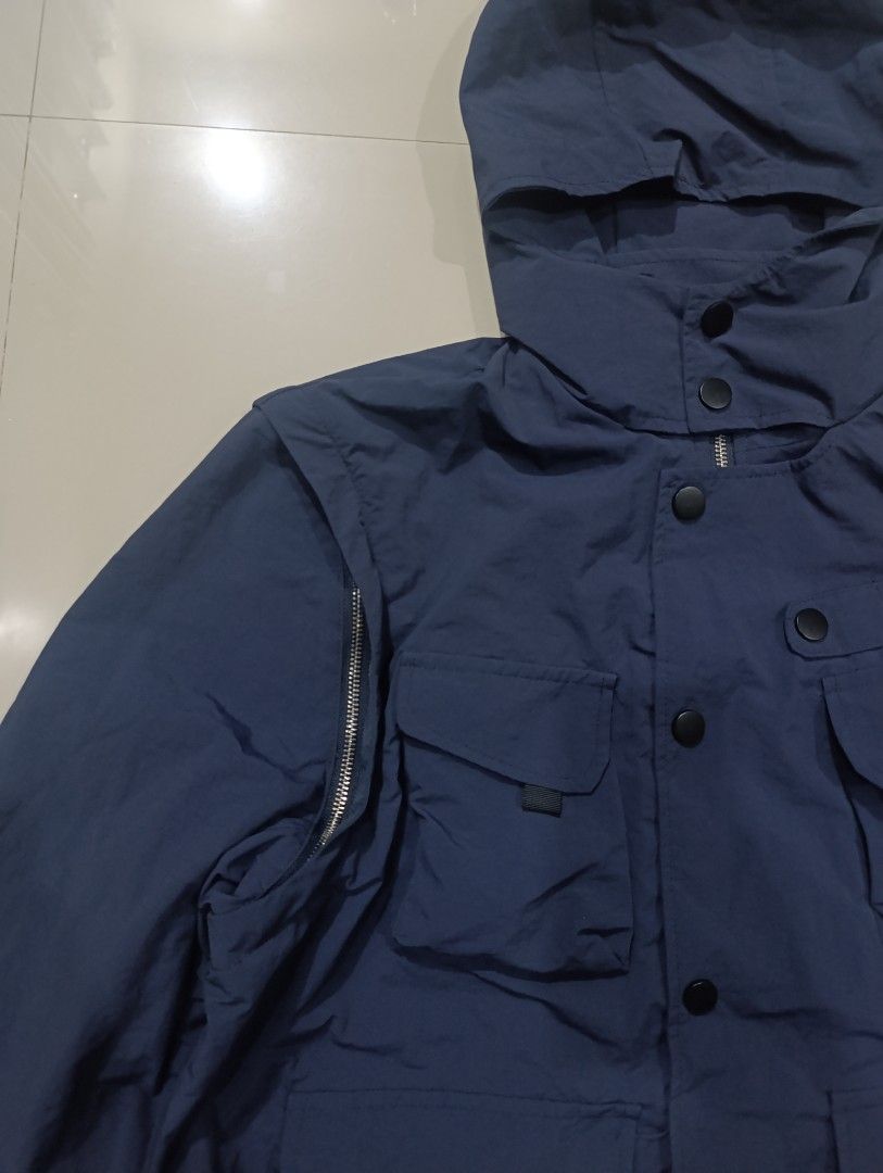 JASPAL Navy Blue Utility Nylon Hooded Jacket (Category: Coats, Jackets and Outerwear) located in Davao. Submitted by idioticthrifter (Listing ID 1470123913, Image 2). Description: - Brand: JASPAL - Color: Navy Blue - Size: L (Tag on collar) - Material: 100% Nylon - Features: Multiple front cargo pockets, snap button closures, shoulder zipper details, and attached hood - Condition: Clean fabric with clear branding and care tags - Style: Functional