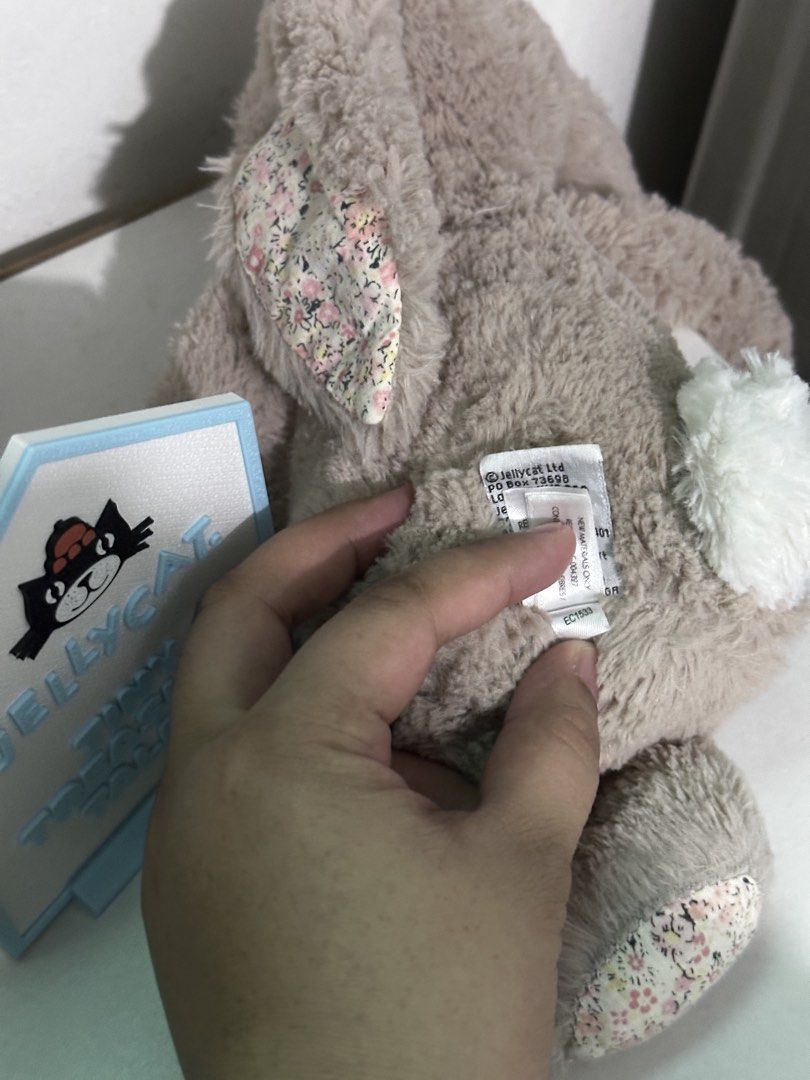 Jellycat Medium Bea Beige Bunny (Category: Plushies & Soft Toys) located in Cabanatuan. Submitted by tinytreasuretales (Listing ID 1469959539, Image 3). Description: - Authentic Jellycat London plush bunny in classic beige - Features charming pink floral fabric on the inner ears and paw pads - Ultra-soft fluffy fur with a cute white fluffy tail - Original cloth tag is attached and intact - Clean and well-maintained condition.