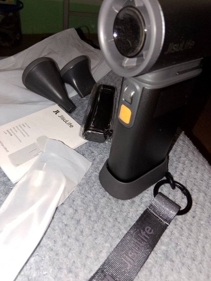 Jisulife Handheld Fan Ultra1 with attachments and strap (Category: Fans) located in Manila. Submitted by camsatalatin (Listing ID 1470124939, Image 2). Description: - Item: Jisulife Handheld Fan Ultra 1 - Color: Dark Gray - Condition: Complete set, packed neatly - Inclusions: 2 nozzle attachments, charging cable, user guide, and branded wrist strap - Best for: Beating the heat outdoors or during your daily commute.