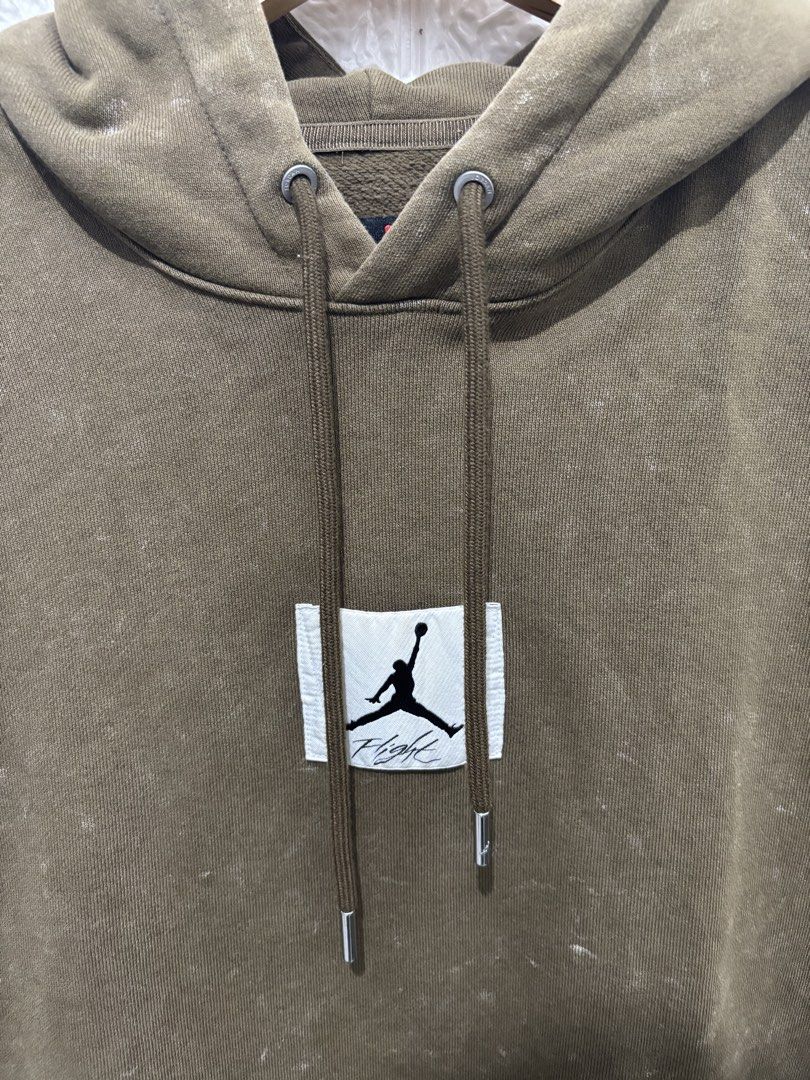 Jordan Flight Olive Green Hoodie (Category: Hoodies) located in Makati City. Submitted by eyesteward (Listing ID 1470091544, Image 3). Description: - Color/Finish: Olive green with a cool vintage wash effect - Material: Premium heavyweight cotton fleece for maximum warmth and comfort - Details: Rectangular stitched Jumpman Flight patch on the chest - Hardware: Premium drawstrings finished with silver metal aglets - Functionality: Classic front ka