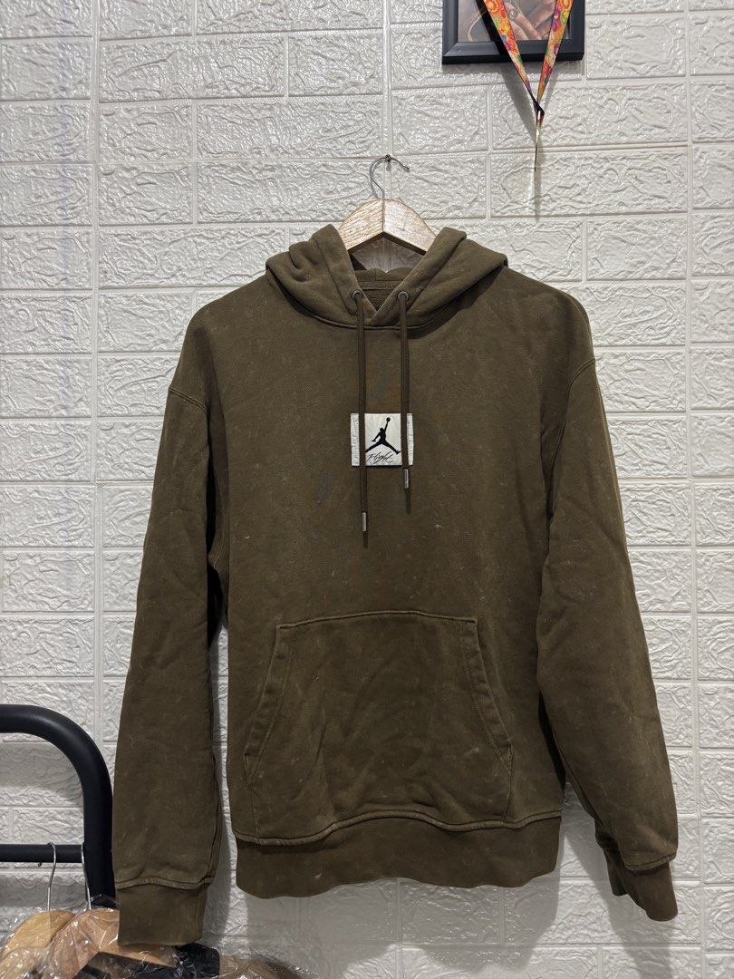 Jordan Flight Olive Green Hoodie (Category: Hoodies) located in Makati City. Submitted by eyesteward (Listing ID 1470091544, Image 2). Description: - Color/Finish: Olive green with a cool vintage wash effect - Material: Premium heavyweight cotton fleece for maximum warmth and comfort - Details: Rectangular stitched Jumpman Flight patch on the chest - Hardware: Premium drawstrings finished with silver metal aglets - Functionality: Classic front ka