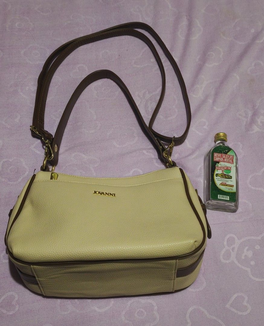 Jovanni Multi-compartment Shoulder Bag (Category: Shoulder Bags) located in Villasis. Submitted by bunnybabe08 (Listing ID 1470132871, Image 1). Description: • Brand: Jovanni • Material: Textured Faux Leather / Synthetic Leather • Color / Hardware: Beige (Tan / Cream) with Brown Trim | Gold-toned zippers and hardware plate • Condition: Like new, used only twice. Flawless exterior, clean interior, and all gold zippers work smoothly. • Inclusions: 