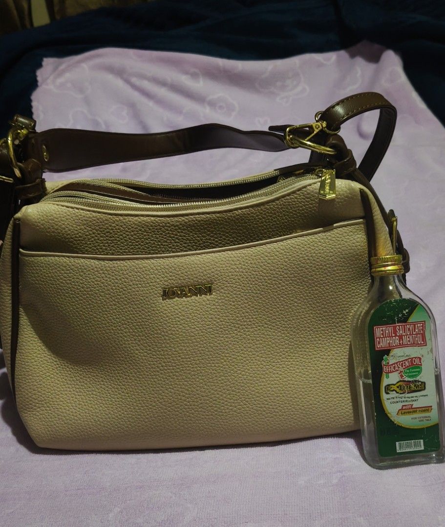 Jovanni Multi-compartment Shoulder Bag (Category: Shoulder Bags) located in Villasis. Submitted by bunnybabe08 (Listing ID 1470132871, Image 2). Description: • Brand: Jovanni • Material: Textured Faux Leather / Synthetic Leather • Color / Hardware: Beige (Tan / Cream) with Brown Trim | Gold-toned zippers and hardware plate • Condition: Like new, used only twice. Flawless exterior, clean interior, and all gold zippers work smoothly. • Inclusions: 