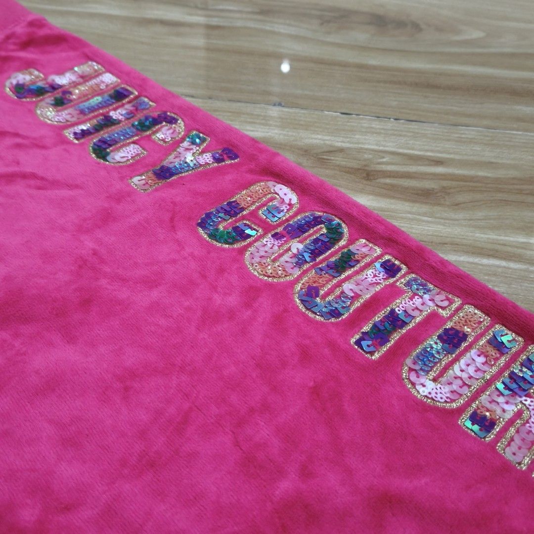 Juicy Couture Black Label Flared Pink Velour (Category: Other Bottoms) located in Cebu City. Submitted by greedthrift.00 (Listing ID 1470133936, Image 3). Description: - Brand: Juicy Couture Black Label - Color: Hot pink - Size: 14 - Material: Super soft velour fabric - Details: Drawstring waist with gold-tone hardware, colorful sequin logo on the left leg - Origin: Made in Vietnam - Style: Y2K casual vibe, comfortable fit.