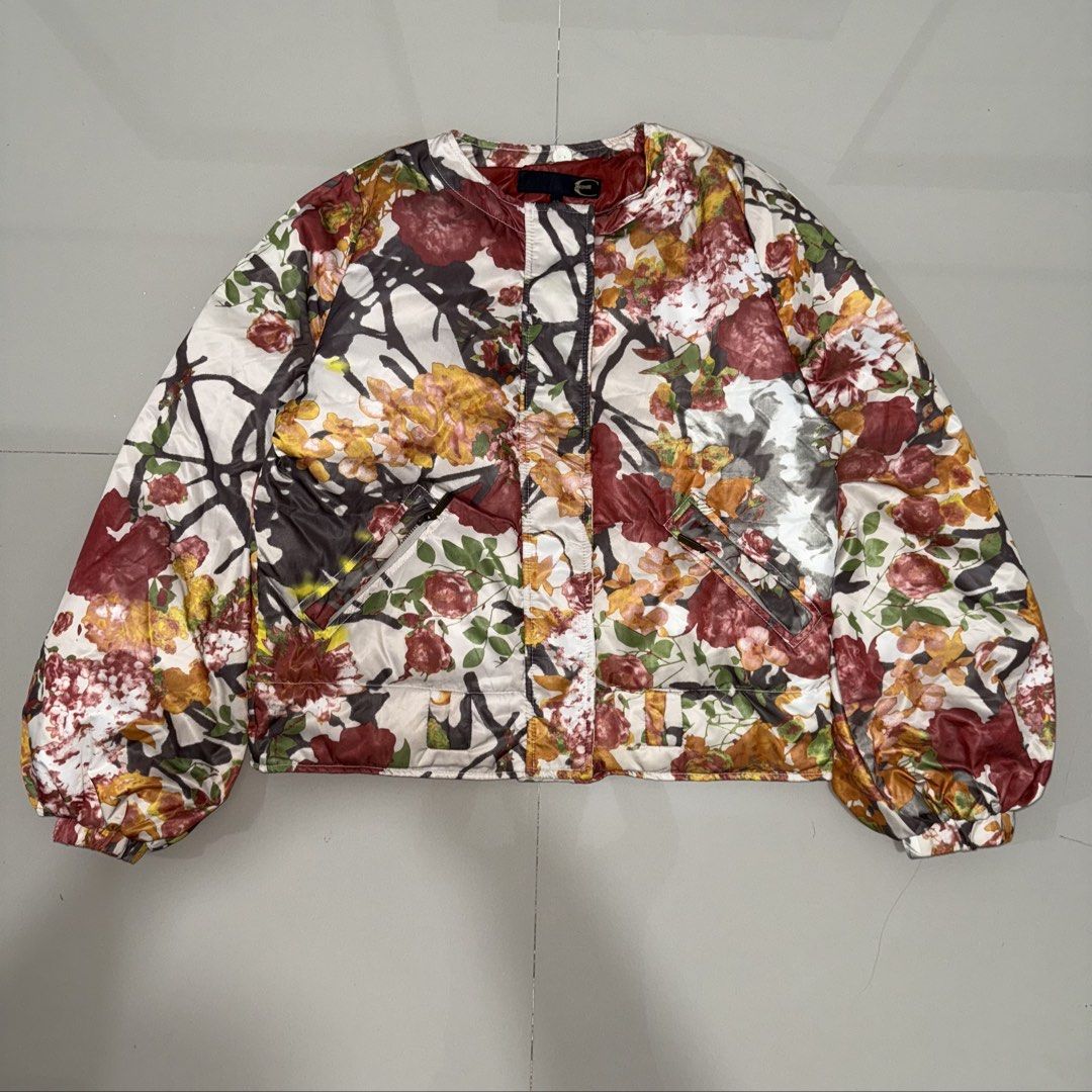 Just Cavalli multi-color floral jacket (Category: Luxury Apparel) located in Calasiao. Submitted by jafaith_man (Listing ID 1470081195, Image 1). Description: Just Cavalli multi-color floral quilted bomber/puffer jacket. It showcases the brand’s signature high-energy aesthetic, pairing a traditional quilted construction with a rich, abstract botanical print filled with deeply saturated red, orange, and gold tones. Size 40 Length 23.5 in. Width 21