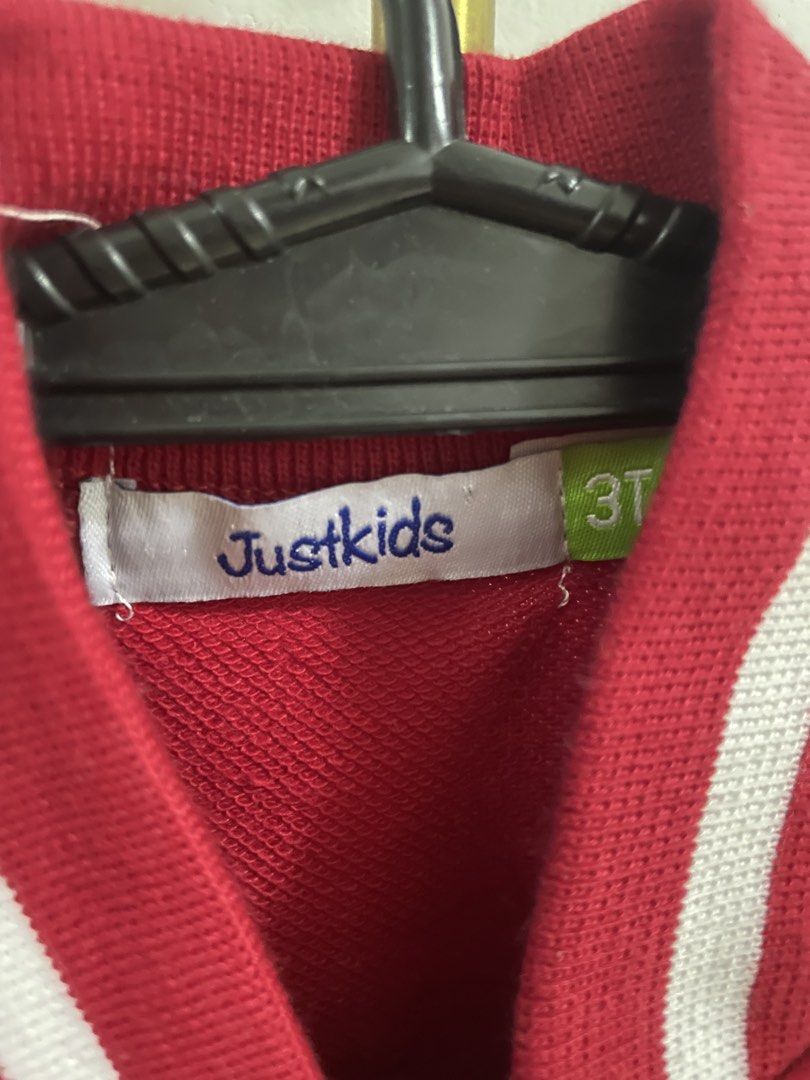 Justkids Red and Grey Varsity Jacket Size 3T (Category: Babies & Kids Fashion) located in San Luis. Submitted by auroraben (Listing ID 1470073144, Image 3). Description: - Brand: Justkids - Size: 3T - Color: Red and grey with white striped ribbing - Material: Soft sweatshirt fabric - Details: Large chenille 'A' patch with cursive embroidery, snap button closure, and two side pockets - Mode of Payment: GCash, BPI.