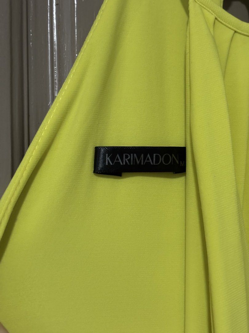 Karimadon Yellow Halter Ruffle Gown (Category: Dresses) located in Quezon City. Submitted by ada_412 (Listing ID 1470128733, Image 3). Description: - Brand: Karimadon - Size: Medium - Color: Bright Yellow - Style: Halter neckline with back keyhole button closure, fitted bodice, and floor-length layered ruffles - Material: Smooth, stretchy fabric - Condition: Excellent.