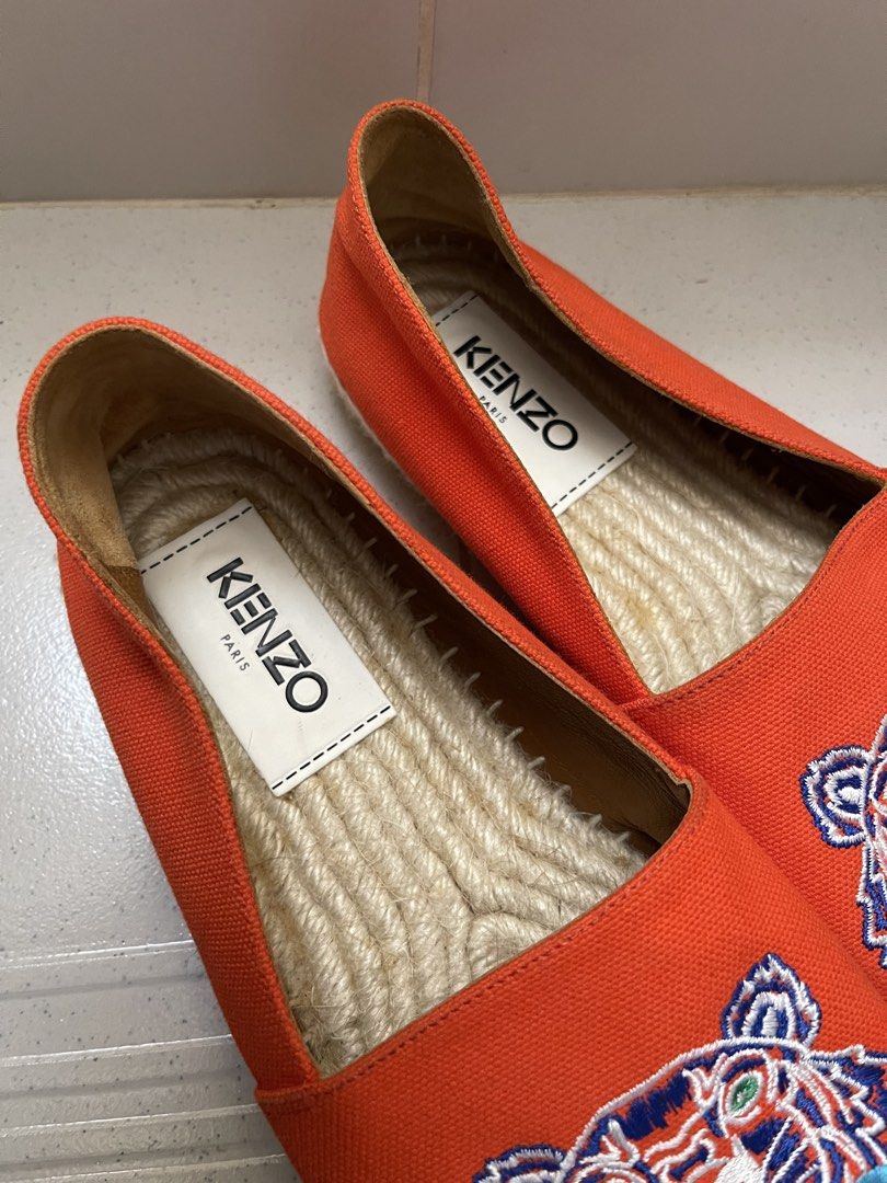 Kenzo Tiger Espadrilles Orange (Category: Flats & Sandals) located in Daraga. Submitted by freestyleselections (Listing ID 1470016164, Image 3). Description: - Brand: Kenzo - Color: Vibrant orange - Design: Iconic embroidered tiger graphic with KENZO PARIS lettering - Material: Canvas upper with jute rope braided soles and white whipstitching - Features: Easy slip-on design, interior fabric lining with brand tags - Condition: Clean soles with min