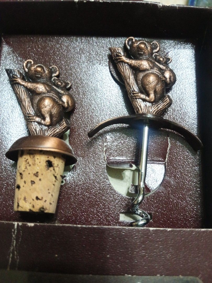 Koala Corkscrew and Bottle Stopper Set (Category: Vintage Collectibles) located in Manila. Submitted by christalyn94263 (Listing ID 1470117095, Image 3). Description: - Wine opener and bottle stopper set featuring a cute koala and baby koala design on tree branches - Elegant bronze-toned metallic finish - Includes a metal screw mechanism opener and a cork-attached bottle stopper - Packaged in an original brown presentation box with a clear plasti