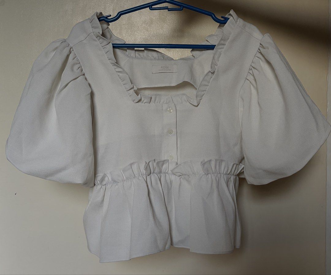 Korean White Puff Sleeve Ruffle Top (Category: Blouses) located in Quezon City. Submitted by ditsysss (Listing ID 1470042547, Image 1). Description: square neckline with ruffled trim & peplum style.