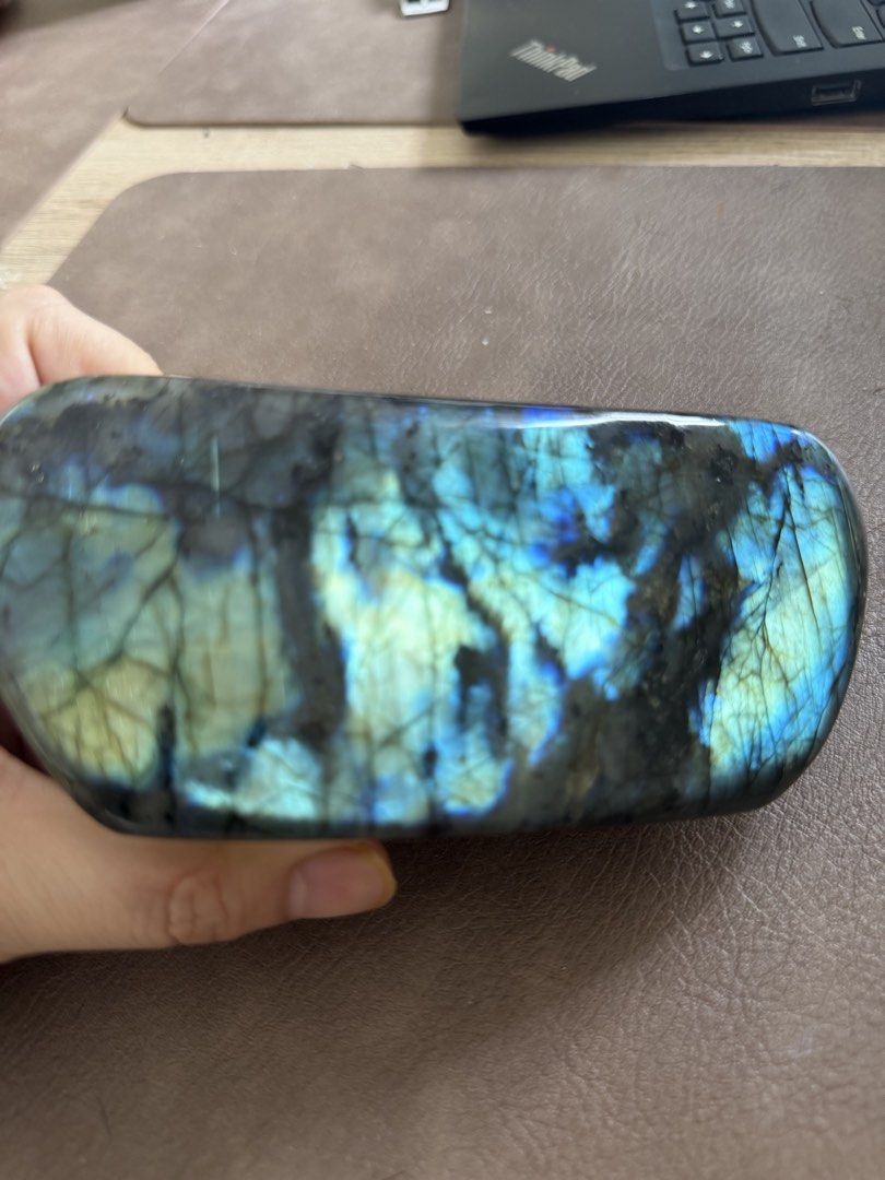 High flash Labradorite Stone with Wooden Stand (Category: Other Home Decor) located in Paranaque City. Submitted by heyandeey (Listing ID 1469952904, Image 3). Description: - High-quality labradorite stone with striking electric blue and yellow flash - Wonderfully smooth, polished surface - ideal for meditation, display, or crystal collections - Flawless condition with no chips or scratches - Includes a custom-carved wooden display stand Approx s