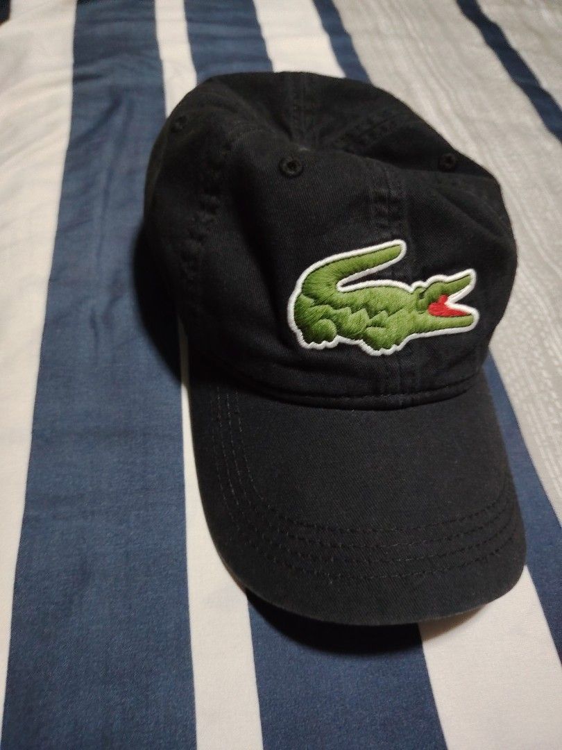 Lacoste Black Cap with Embroidered Crocodile Logo (Category: Caps & Hats) located in Manila. Submitted by snooks1938 (Listing ID 1470115857, Image 3). Description: Up For Sale.. 100% Legit or Money back.. - Authentic black Lacoste baseball cap - Large embroidered green and red crocodile logo on the front - Classic dad hat fit with a curved brim - Structured panels with eyelets for ventilation - Clean fabric and great for daily casual wear.
