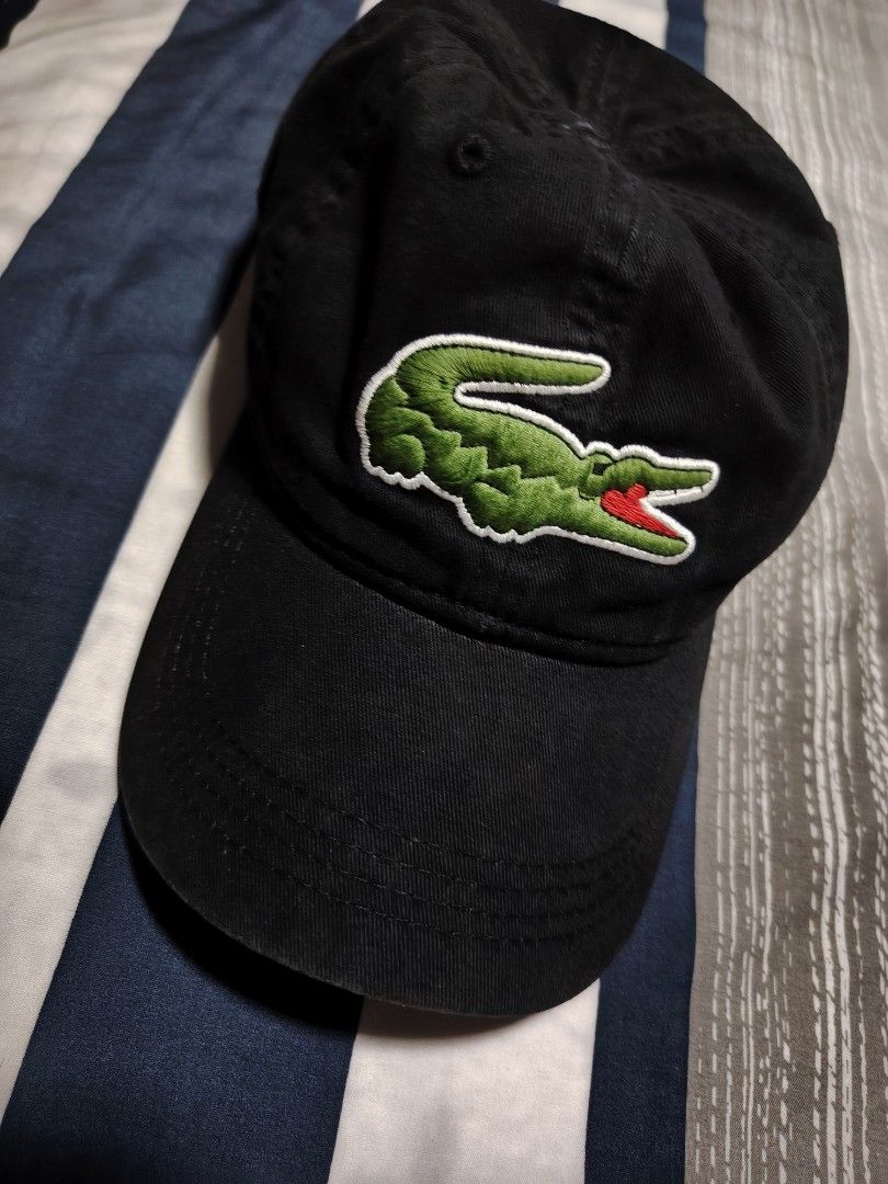 Lacoste Black Cap with Embroidered Crocodile Logo (Category: Caps & Hats) located in Manila. Submitted by snooks1938 (Listing ID 1470115857, Image 2). Description: Up For Sale.. 100% Legit or Money back.. - Authentic black Lacoste baseball cap - Large embroidered green and red crocodile logo on the front - Classic dad hat fit with a curved brim - Structured panels with eyelets for ventilation - Clean fabric and great for daily casual wear.