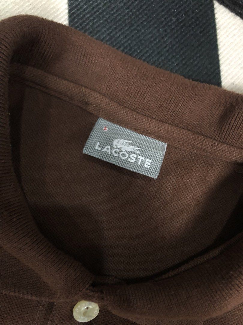 Lacoste Brown Polo Shirt Size 5 (Category: Tshirts & Polo Shirts ) located in Manila. Submitted by ejaay_2012 (Listing ID 1470104501, Image 2). Description: - Brand: Lacoste - Color: Brown - Size: 5 - Style: Short sleeves, standard collar with 2 buttons - Details: Classic green crocodile logo on the chest - Care: Machine wash cold - Condition: Clean and ready to wear.