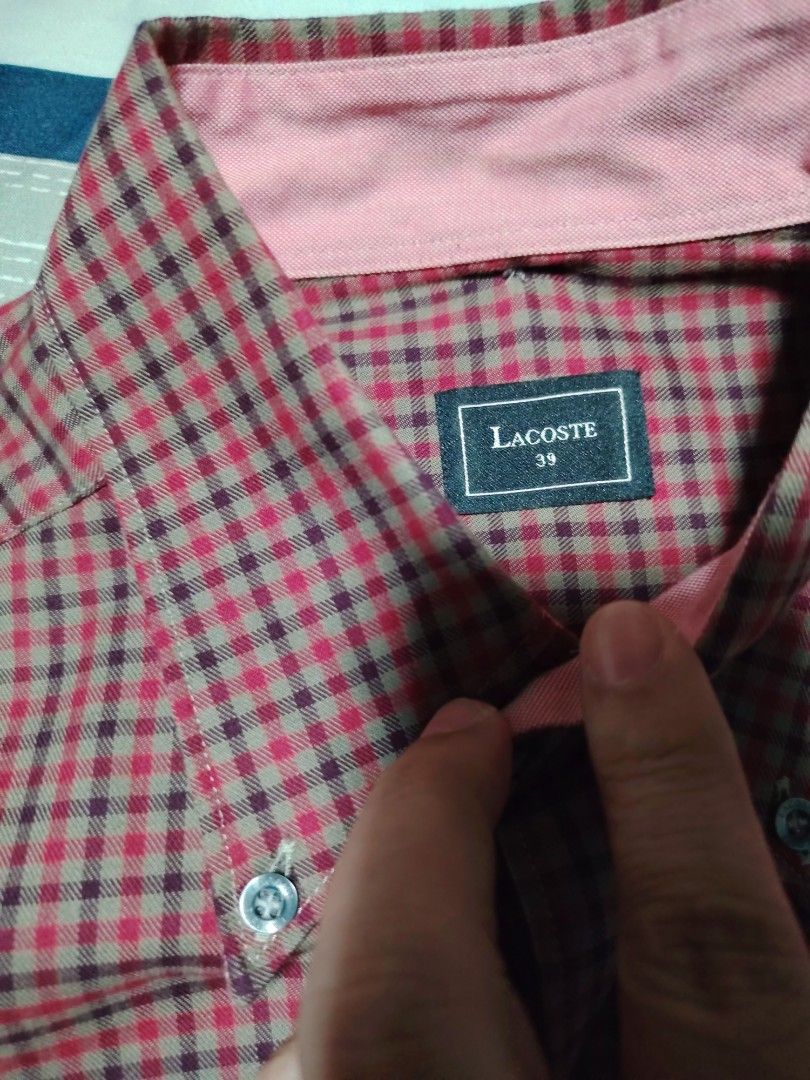 Lacoste Checkered Long Sleeve Button-Down Shirt (Category: Formal Shirts) located in Manila. Submitted by snooks1938 (Listing ID 1470115013, Image 2). Description: Up For Sale.. Men's LACOSTE Long Sleeves - Brand: Lacoste - Size: (39 XS or Small) - Pattern: Red and black checkered all over - Details: Button-down collar with contrast pink inner lining - Pocket: Front chest pocket with signature embroidered crocodile logo - Closure: Standard front 