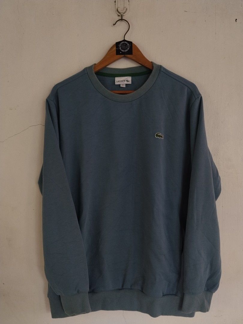 Lacoste Light Blue Sweatshirt Crewneck (Category: Coats, Jackets and Outerwear) located in Ilog. Submitted by jzee03 (Listing ID 1470042326, Image 1). Description: Lacoste Crewneck Sweatshirt L on tag Dimes: 23x28. 5 Color rate: 9/10 Very Good Condition Issue: Light fade on Collar 900 Freeshipping .