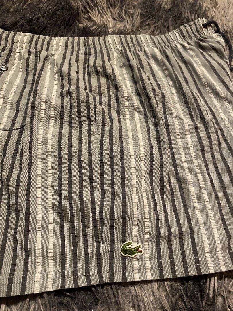 LACOSTE MENS STRIPED SWIM TRUNKS (Category: Swim Trunks & Board Shorts) located in Minglanilla. Submitted by celathrift (Listing ID 1470070859, Image 2). Description: AS NEW CONDITION NO ISSUE OVER ALL 9.5/10 COLO RATE WAIST (GARTER/OSFA) LENGTH (17).