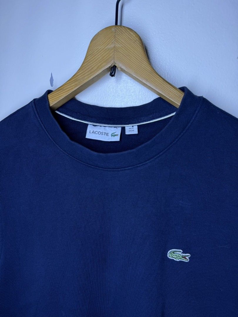 LACOSTE NAVY BLUE SWEATER (Category: Coats, Jackets and Outerwear) located in Manila. Submitted by lunaras_declutter (Listing ID 1470107516, Image 3). Description: MEDIUM LIKE NEW.