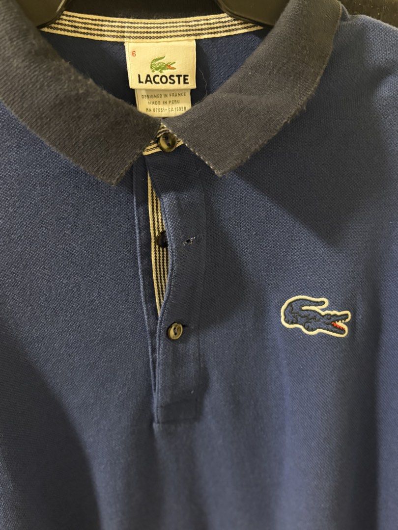 lacoste original (Category: Tshirts & Polo Shirts ) located in Makati City. Submitted by sausage011 (Listing ID 1469986973, Image 3). Description: - 2k for both Authentic Blue Lacoste long sleeve polo shirt - Size 6 and 5 Designed in France, Made in Peru) - Stylish contrasting dark collar with striped inner placket lining - Iconic embroidered crocodile logo on the chest - Long sleeves, ideal for cooler weather - Easy care: machine wash warm.