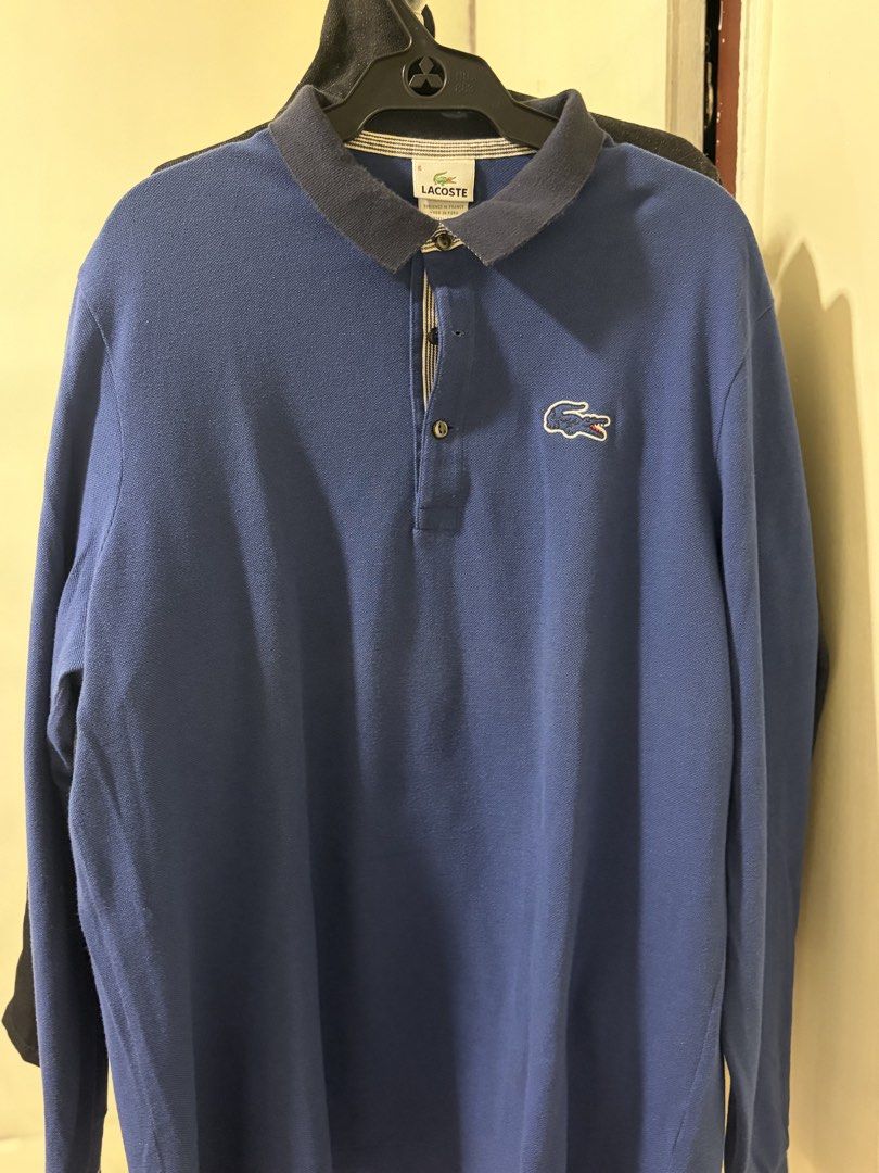 lacoste original (Category: Tshirts & Polo Shirts ) located in Makati City. Submitted by sausage011 (Listing ID 1469986973, Image 2). Description: - 2k for both Authentic Blue Lacoste long sleeve polo shirt - Size 6 and 5 Designed in France, Made in Peru) - Stylish contrasting dark collar with striped inner placket lining - Iconic embroidered crocodile logo on the chest - Long sleeves, ideal for cooler weather - Easy care: machine wash warm.