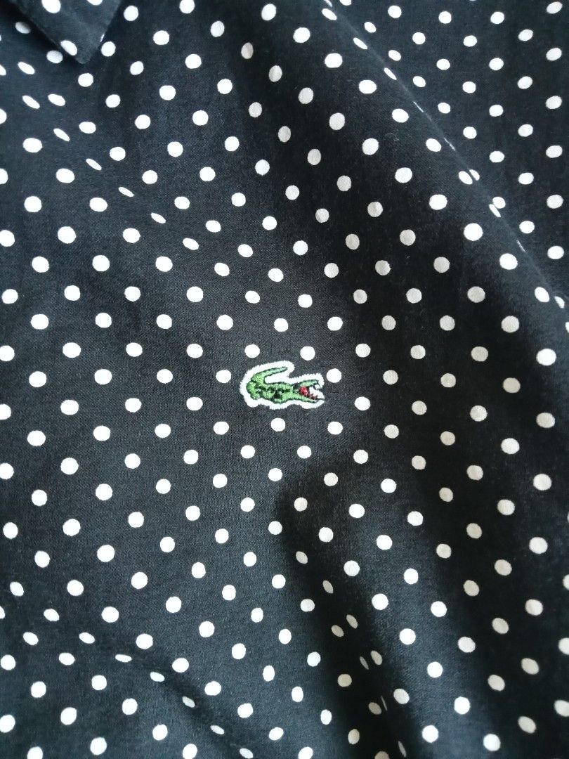 Lacoste polka dots buttondown shortsleeve polo (Category: Shirts) located in Bagabag. Submitted by thrift_stories96 (Listing ID 1470125708, Image 3). Description: Lacoste polka dots buttondown shortsleeve polo Size 38 - medium womens Length - 23 Width - 18 Condition - excellent No flaw.