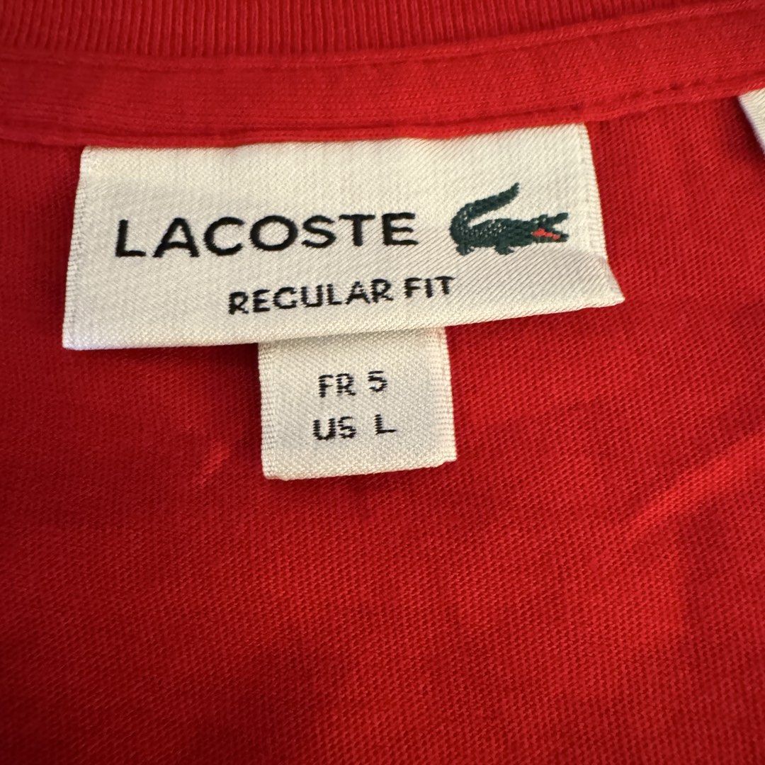 Lacoste Regular Fit V-Neck T-Shirt Red (Category: Tshirts & Polo Shirts ) located in Pasig City. Submitted by mon.alcantara (Listing ID 1469960137, Image 3). Description: - Brand: Lacoste - Color: Bright Red - Style: V-neck, short sleeves, regular fit - Logo: Iconic embroidered blue crocodile on the chest of around 10cm in length - Size: French Size 5 / US Large - Origin: Made in Peru - Condition: Clean fabric, vibrant color, well-maintained - Wa