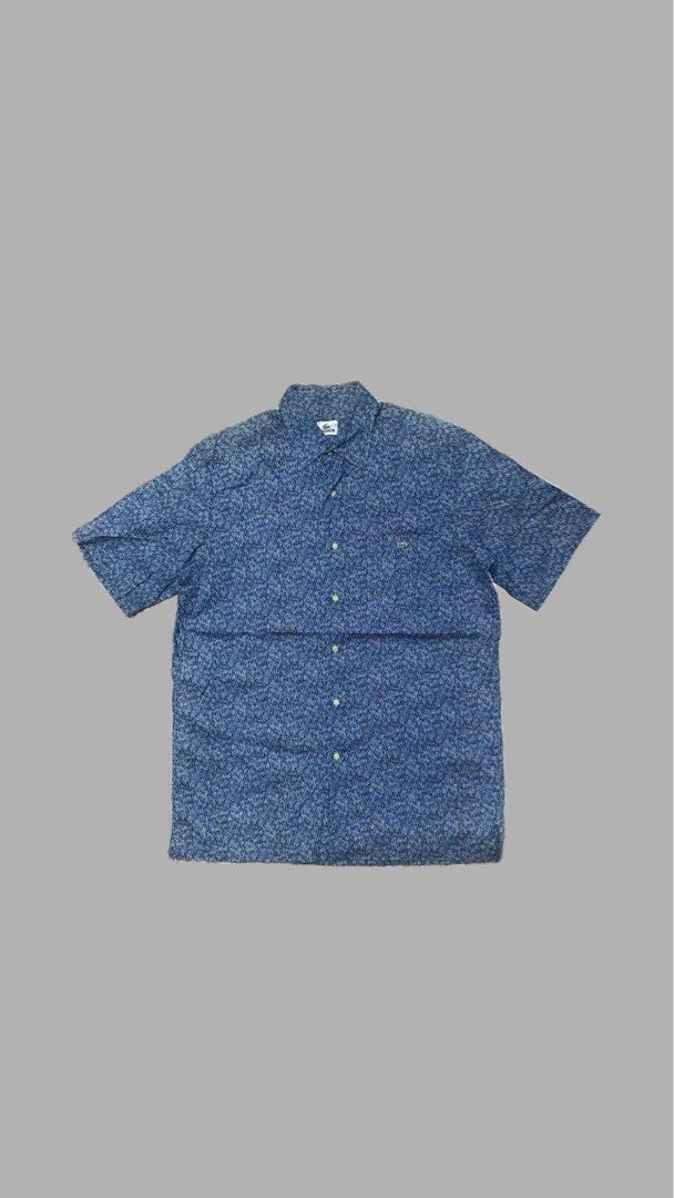 Lacoste Short Sleeve Button Down Shirt Size 41 (Category: Tshirts & Polo Shirts ) located in Navotas City. Submitted by vincent_mosqueriola (Listing ID 1470053754, Image 1). Description: - Brand: Lacoste - Type: Short sleeve button-down shirt - Size: 41 - Color: Blue with all-over textured dash pattern - Material: 100% lightweight cotton - Details: Standard collar, front chest pocket with embroidered crocodile logo - Style: Great casual piece for