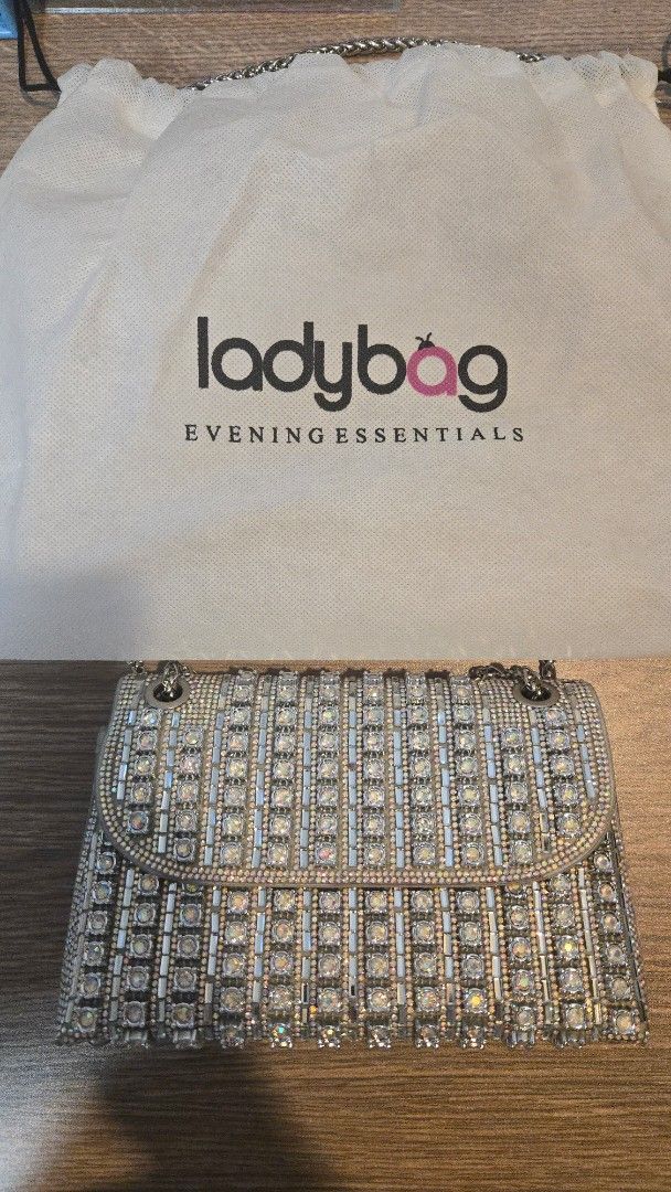 Ladybag Evening Essentials Rhinestone Shoulder Bag (Category: Luxury Bags & Wallets) located in Quezon City. Submitted by pjk2135 (Listing ID 1470005675, Image 3). Description: Brand: Ladybag Bought: December 2025 for 1,900 PHP but only selling for 1,600 PHP (willing to negotiate) Condition: Practically brand new! (used only once) - The gems have a shimmering rainbow effect, which I find attractive MOP: Gcash You can pick up at our location or bo