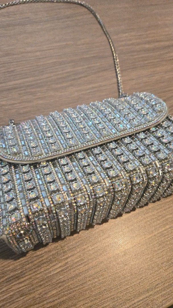 Ladybag Evening Essentials Rhinestone Shoulder Bag (Category: Luxury Bags & Wallets) located in Quezon City. Submitted by pjk2135 (Listing ID 1470005675, Image 2). Description: Brand: Ladybag Bought: December 2025 for 1,900 PHP but only selling for 1,600 PHP (willing to negotiate) Condition: Practically brand new! (used only once) - The gems have a shimmering rainbow effect, which I find attractive MOP: Gcash You can pick up at our location or bo