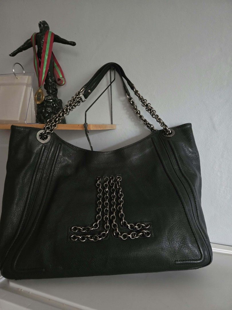 Lanvin Black Hobo Tote Bag (Category: Shoulder Bags) located in Bangued. Submitted by shopaholic.girliee. (Listing ID 1469991488, Image 1). Description: Pretty in person very chanel vibes. - Color: Black - Material: Genuine Leather - Accents: Chunky silver-tone chain on the front and dual shoulder straps with comfortable leather top sections - Pockets: Exterior slip pocket on the back - Interior: Roomy and spacious for everyday essentials - Rank 