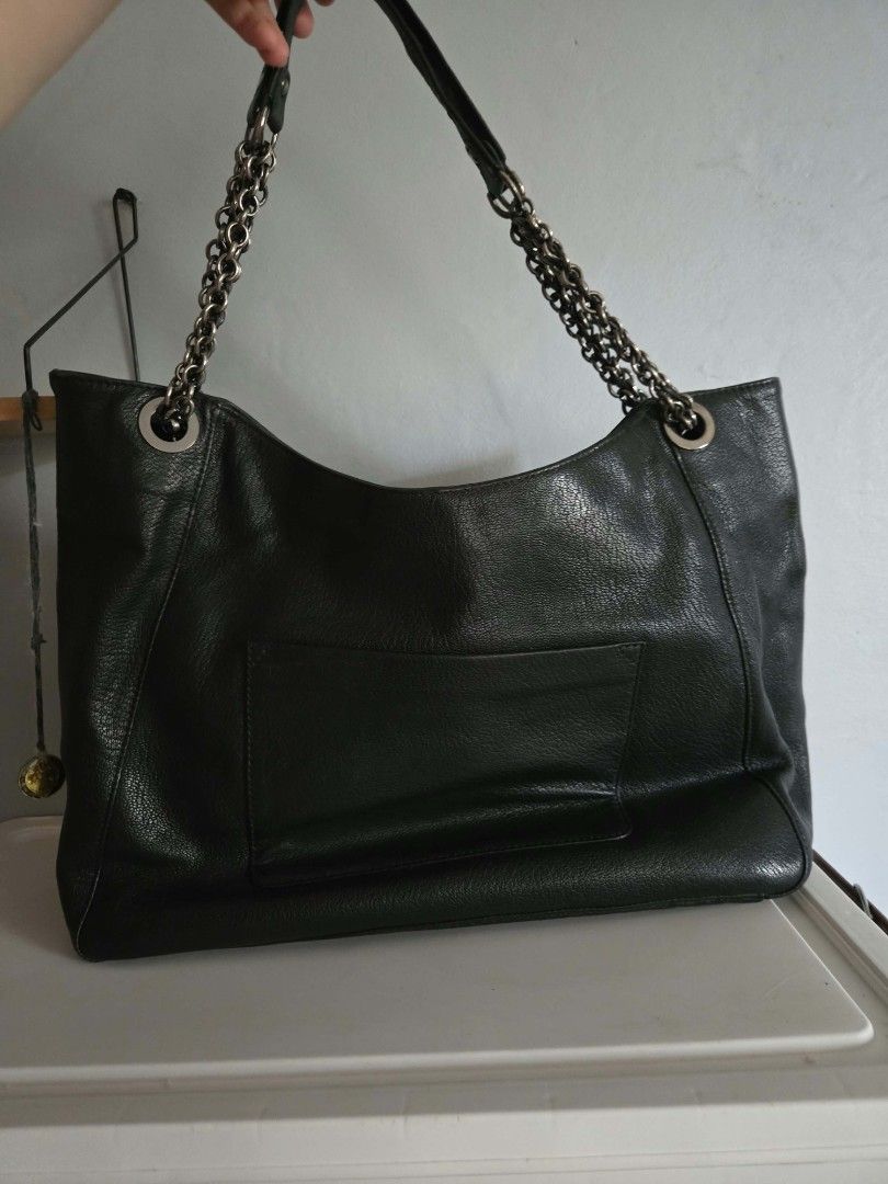 Lanvin Black Hobo Tote Bag (Category: Shoulder Bags) located in Bangued. Submitted by shopaholic.girliee. (Listing ID 1469991488, Image 2). Description: Pretty in person very chanel vibes. - Color: Black - Material: Genuine Leather - Accents: Chunky silver-tone chain on the front and dual shoulder straps with comfortable leather top sections - Pockets: Exterior slip pocket on the back - Interior: Roomy and spacious for everyday essentials - Rank 