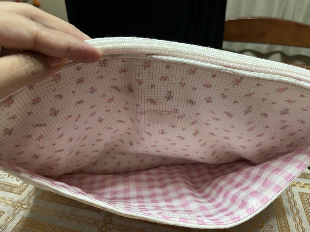 Laptop bag (Category: Purses & Pouches) located in Bacoor. Submitted by ayit. (Listing ID 1470059706, Image 3). Description: Orig new japan gling sf inc - Type: Laptop bag / pouch - Design: White with pink floral pattern exterior - Interior: Pink gingham check lining with extra compartment - Closure: Secure top zip - Condition: Good, well-maintained - Perfect for daily commute, school, or work.