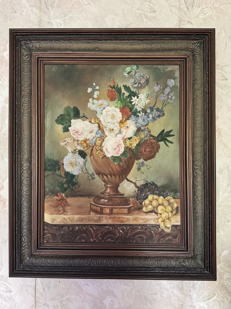 Large Framed Floral Still Life Artwork – Ornate Classical Frame (Category: Frames & Pictures) located in Makati City. Submitted by maria.1024 (Listing ID 1470138596, Image 1). Description: Beautiful traditional floral still-life artwork featuring an elegant urn filled with roses and assorted flowers, complemented by grapes and fruit. The artwork is presented in a substantial, dark brown ornamental frame with intricate carved-style detailing, givi