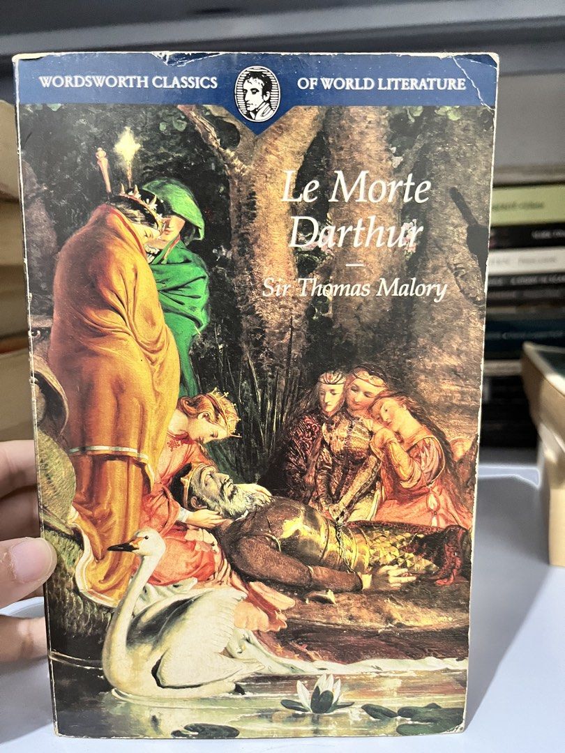 Le Morte Darthur Sir Thomas Malory Wordsworth Classics (Category: Storybooks) located in Maragondon. Submitted by quilljoylibrary (Listing ID 1469984399, Image 1). Description: - Title: Le Morte Darthur by Sir Thomas Malory - Edition: Wordsworth Classics (Softcover with classic art cover) - Condition: Readable copy with yellowed pages and browned text block edges - Flaws: Spine shows wear, creases, and peeling along the edges - Details: Spine let