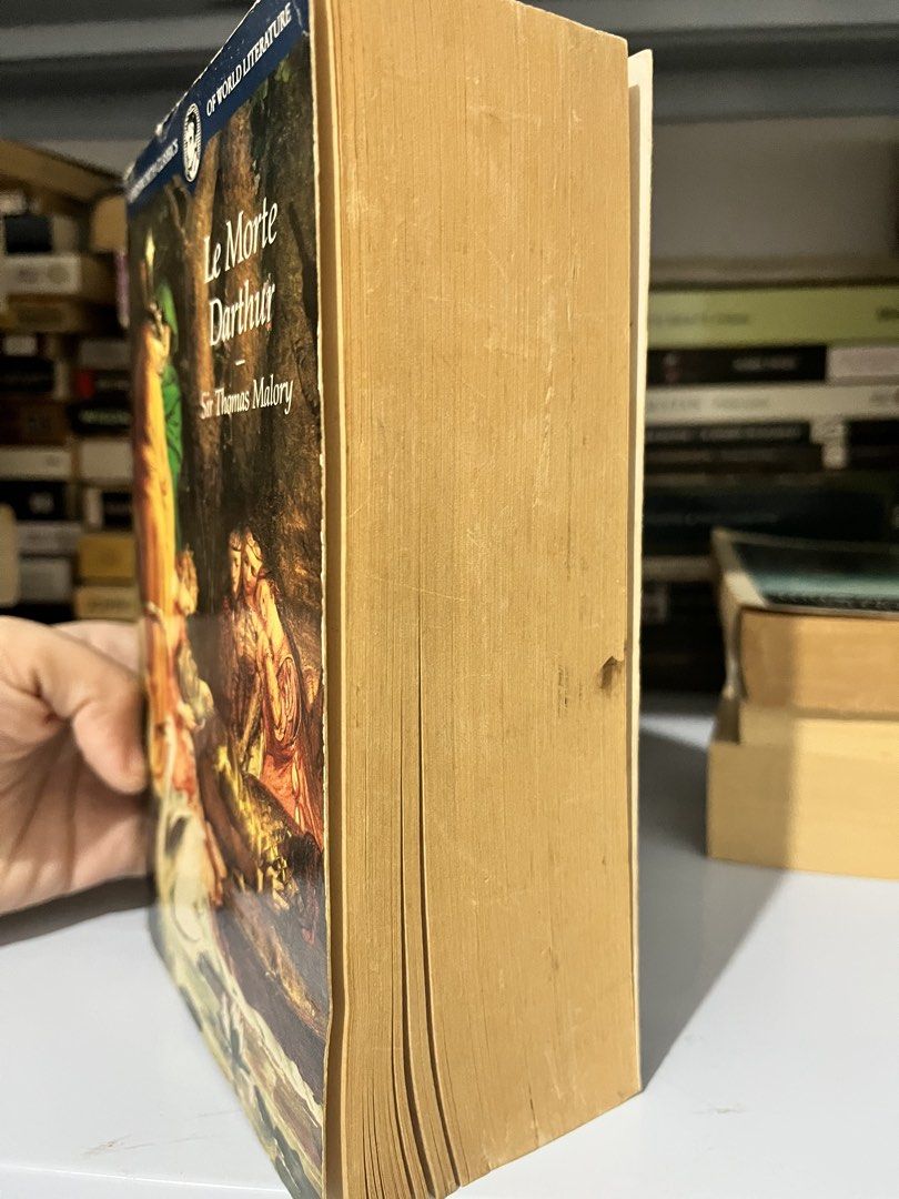 Le Morte Darthur Sir Thomas Malory Wordsworth Classics (Category: Storybooks) located in Maragondon. Submitted by quilljoylibrary (Listing ID 1469984399, Image 3). Description: - Title: Le Morte Darthur by Sir Thomas Malory - Edition: Wordsworth Classics (Softcover with classic art cover) - Condition: Readable copy with yellowed pages and browned text block edges - Flaws: Spine shows wear, creases, and peeling along the edges - Details: Spine let