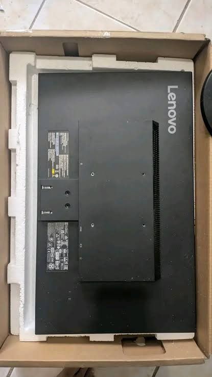 Lenovo Desktop Computer Monitor Screen (Category: Monitor Screens) located in Caloocan City. Submitted by workremote64613 (Listing ID 1470115409, Image 3). Description: - Brand: Lenovo - Color: Sleek black with slim bezels and matte screen finish - Stand: Sturdy round base stand included - Mounting & Ports: VESA mount compatible, with ports conveniently located underneath the back ridge - Condition: Clean unit, well-maintained - Packaging: Comes 