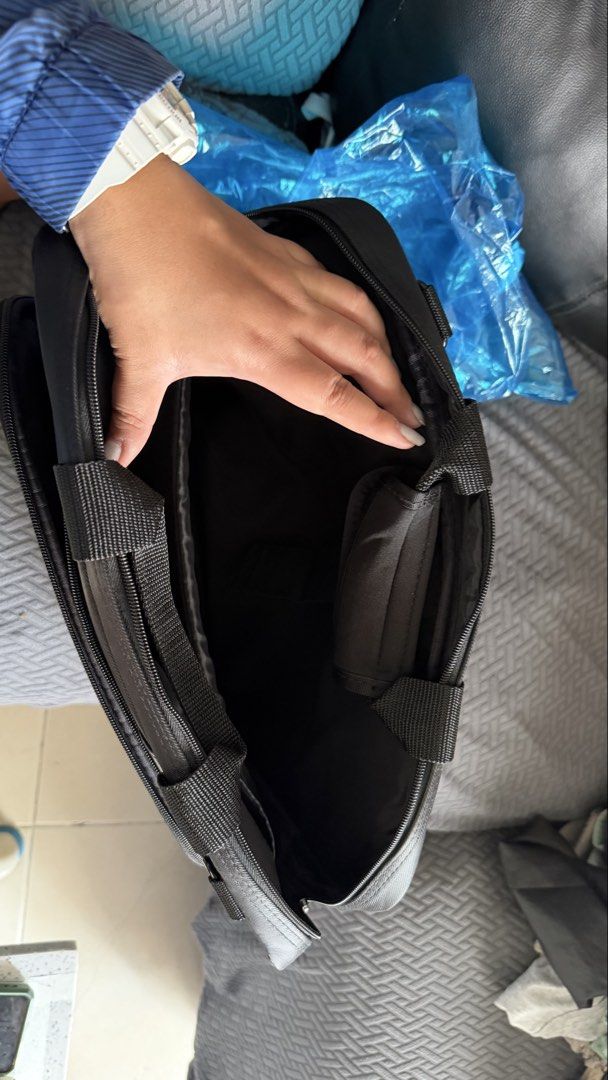 Lenovo ThinkPad Laptop Bag Briefcase (Category: Laptop Bags & Sleeves) located in Pasay City. Submitted by yssavibe14 (Listing ID 1470007143, Image 3). Description: - Brand/Model: Lenovo ThinkPad Laptop Bag - Color: Classic Black with Faux Leather Trim - Material: Durable fabric, clean inside and out - Storage: Front zippered pocket for chargers/cables + main compartment with internal dividers - Portability: Sturdy top handles and metal D-ring fo