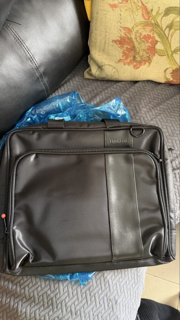 Lenovo ThinkPad Laptop Bag Briefcase (Category: Laptop Bags & Sleeves) located in Pasay City. Submitted by yssavibe14 (Listing ID 1470007143, Image 2). Description: - Brand/Model: Lenovo ThinkPad Laptop Bag - Color: Classic Black with Faux Leather Trim - Material: Durable fabric, clean inside and out - Storage: Front zippered pocket for chargers/cables + main compartment with internal dividers - Portability: Sturdy top handles and metal D-ring fo