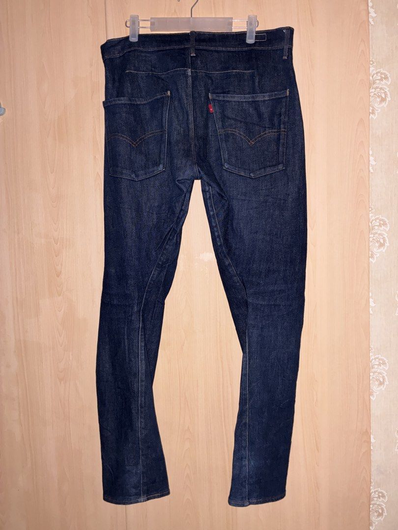 Levi Strauss & Co. Dark Wash Denim Jeans (Category: Jeans) located in Placer. Submitted by talaalond61563 (Listing ID 1469966768, Image 2). Description: - Brand: Levi Strauss & Co. - Wash: Dark indigo - Fit: Straight leg - Details: Classic 5-pocket setup, contrast stitching, branded metal buttons, and iconic red tab - Material: Sturdy twill fabric with visible diagonal weave texture - Condition: Excellent quality, versatile for any outfit.