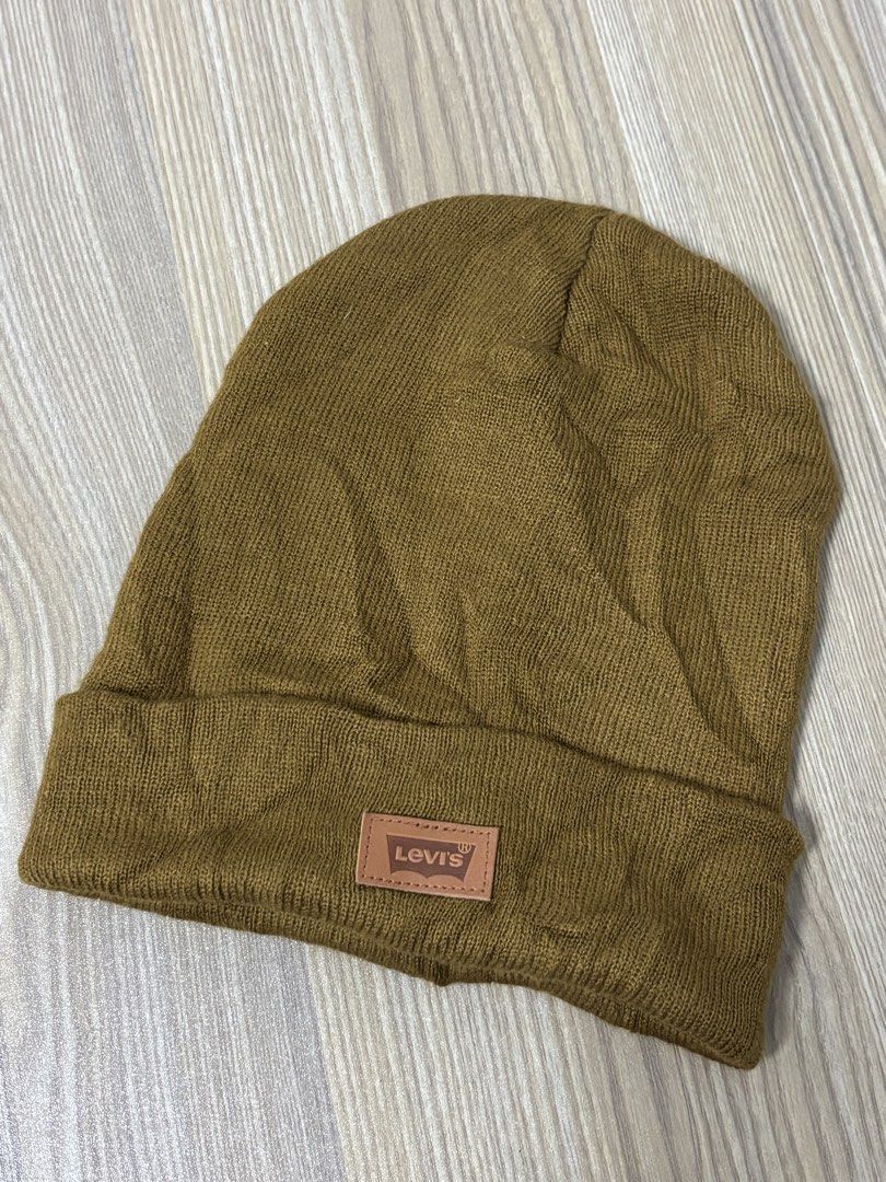 Levi's Brown Knitted Beanie Hat (Category: Hats & Beanies) located in Silang. Submitted by lakasthrift1577 (Listing ID 1470074033, Image 1). Description: - Brand: Levi's - Style: Ribbed knit beanie with fold-over cuff - Color: Classic Brown - Details: Faux leather front patch logo and interior iconic Levi's red tab label - Material: Warm, cozy winter fabric - Size: Standard adult sizing - Condition: Brand new / Excellent quality -adult size - exc