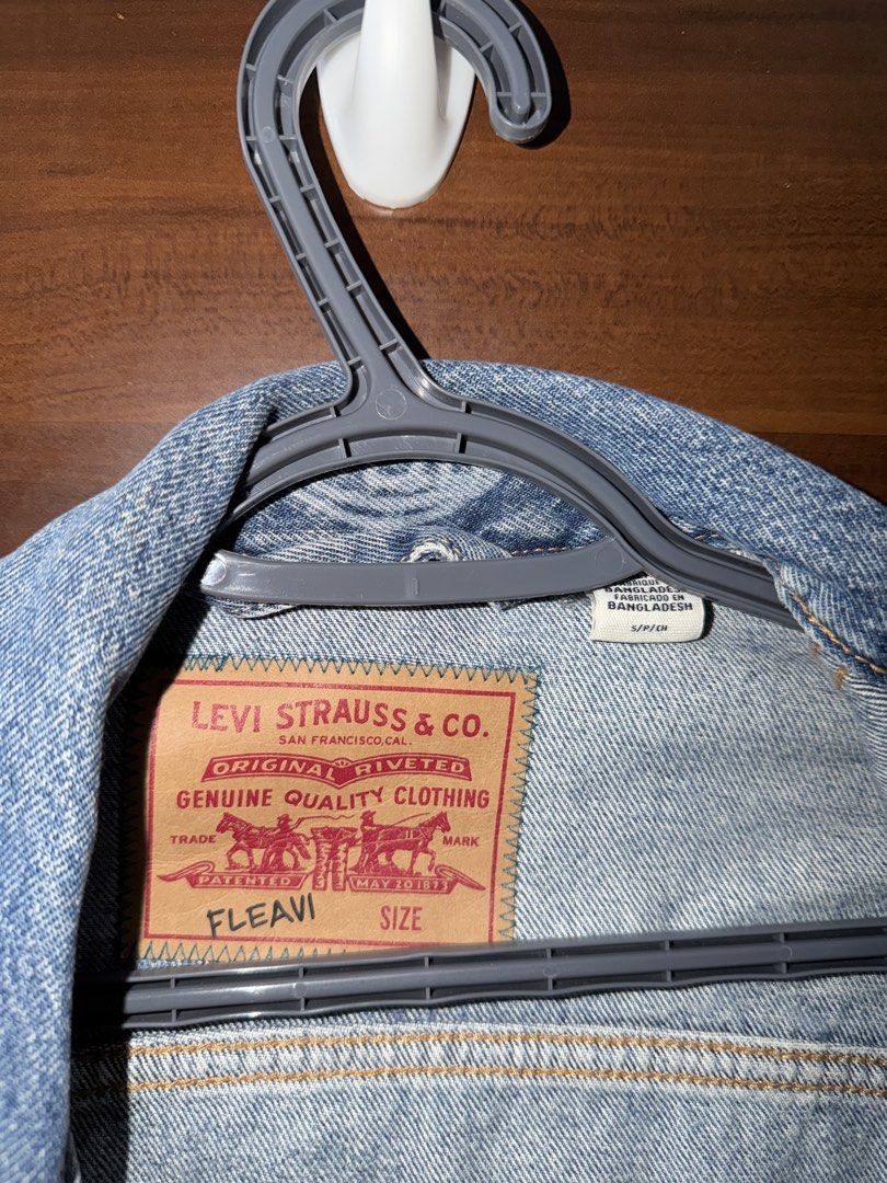Levi's Fleavi Collab Denim Jacket (UNISEX) (Category: Coats, Jackets and Outerwear) located in Mandaluyong City. Submitted by kadynkelsey (Listing ID 1470037833, Image 2). Description: - Brand: Levi's - Size: S -Loose fit - Design: Loose fit Unique bleached all-over photo print wash covering front, back, and sleeves - Features: Classic button-up front, dual chest pockets, and collar - Material: Sturdy denim - Condition/Style: Great statement piec