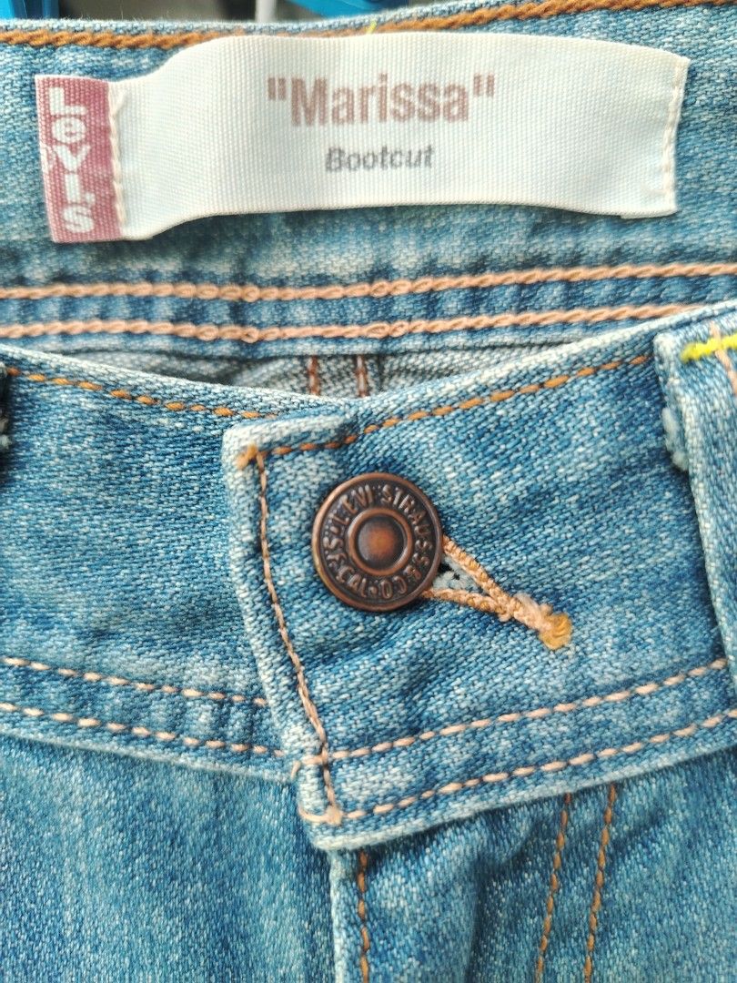 Levi's Marissa Bootcut Jeans Light Wash (Category: Jeans) located in Davao. Submitted by enchanted08 (Listing ID 1469973608, Image 3). Description: - Brand: Levi's (Marissa Bootcut) - Color/Wash: Light blue with front thigh whiskering - Rise: Mid-to-low rise fit - Details: Classic five-pocket styling, copper rivets, button closure, and contrast stitching - Condition: Excellent, ready to wear - Perfect for pairing with sneakers or boots! - fits 28