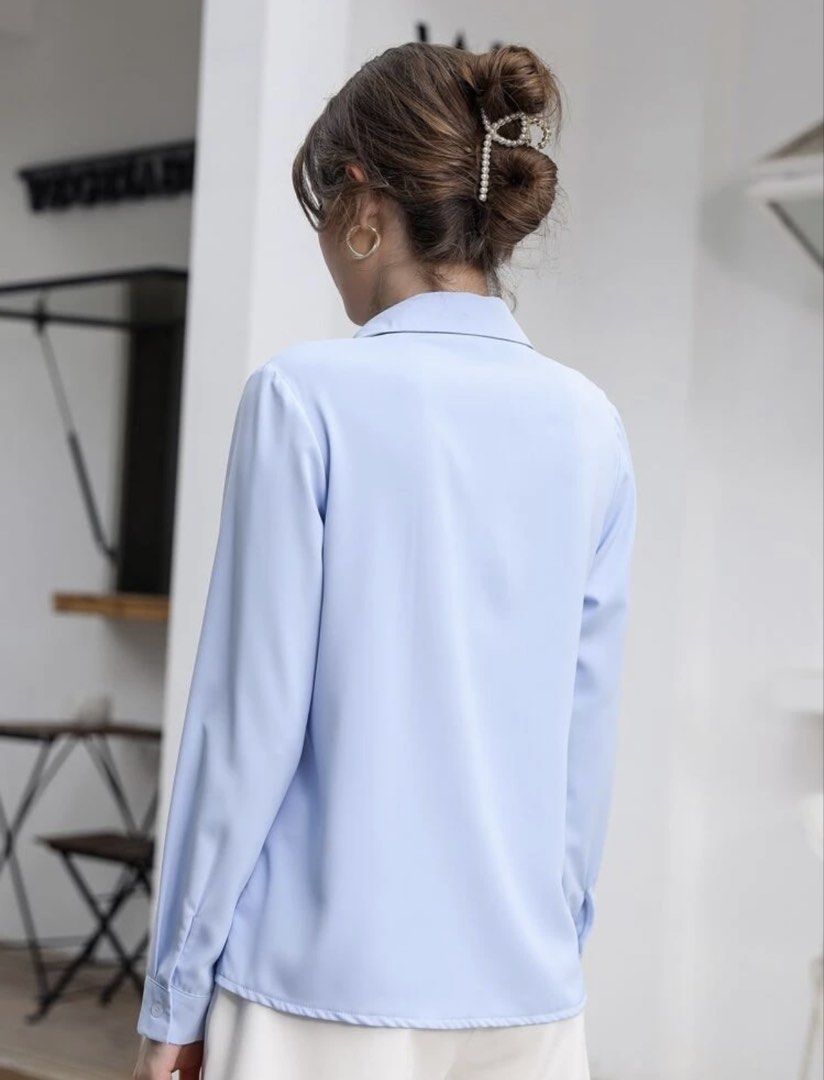 Light blue button-down long sleeve shirt (Category: Longsleeves) located in Manila. Submitted by jamie_closet (Listing ID 1469961210, Image 3). Description: - Light blue long sleeve blouse with a classic collar - Front button placket featuring hidden buttons - Made from smooth, lightweight material for all-day comfort - Versatile solid color design, easy to pair with trousers or skirts - Perfect for both workwear and casual days - Please check th