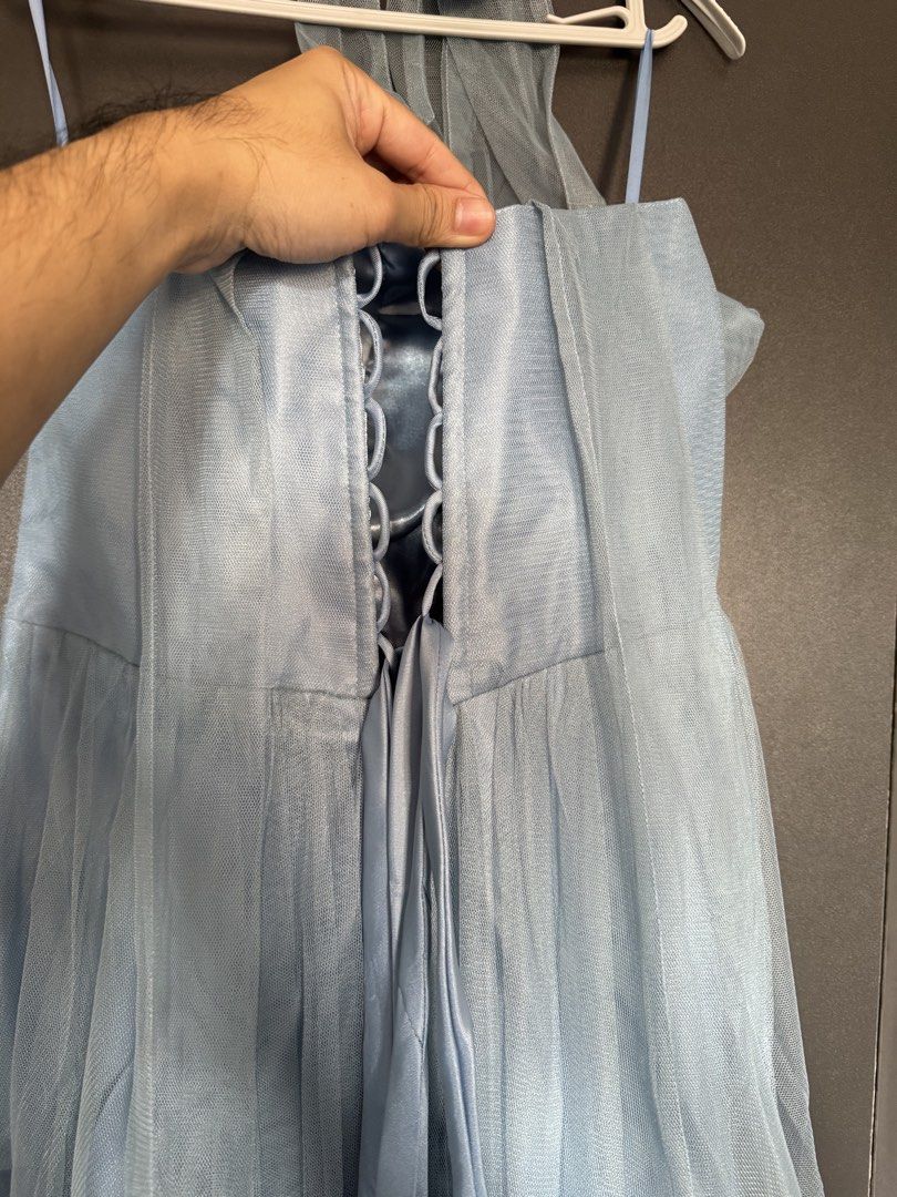 Light Blue Dress Gown (Category: Evening dresses & gowns) located in Dasmarinas. Submitted by akelvin23 (Listing ID 1470112361, Image 3). Description: - Color: Light blue - Material: Tulle overlay with smooth satin lining - Closure: Adjustable lace-up corset back with ribbon ties - Length: Flowing floor-length skirt - Condition: Worn only once, freshly cleaned, and ready to wear Dusty blue Waist - 32 in Bust - 34 in approx Length - 50 in - from p